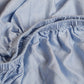 Børne kuvertlagen i TENCEL™ twill lyseblå 90x200