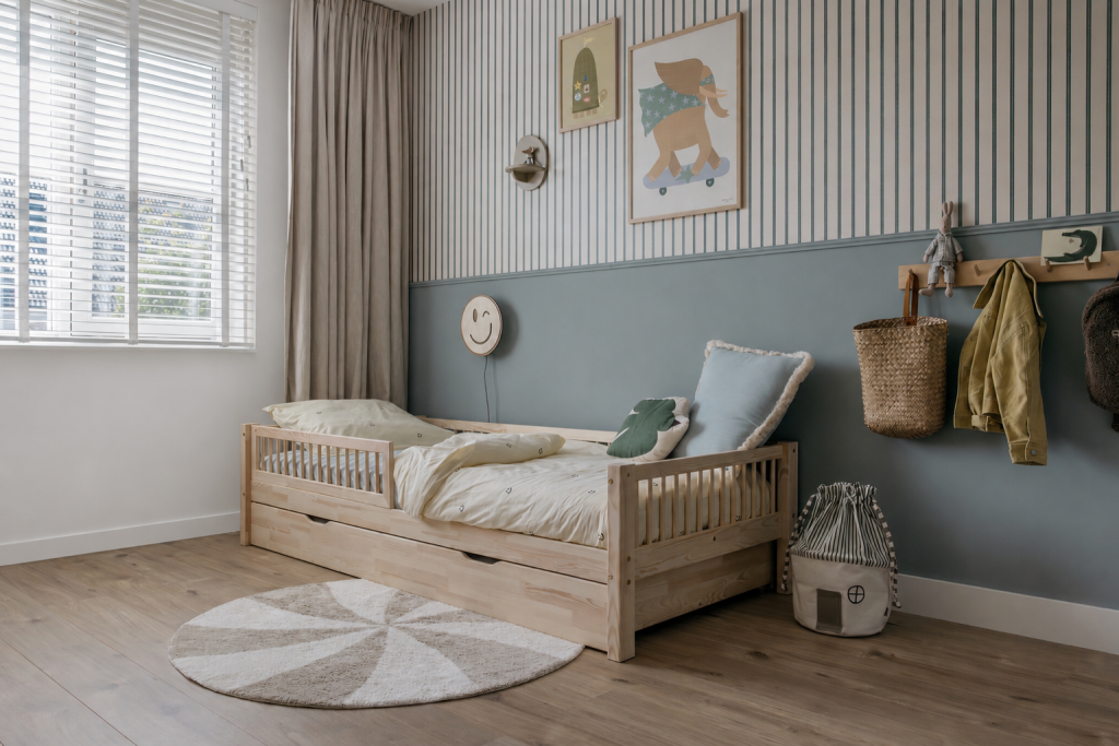 Children's bedroom with wooden bed, striped walls, and decorative elements.